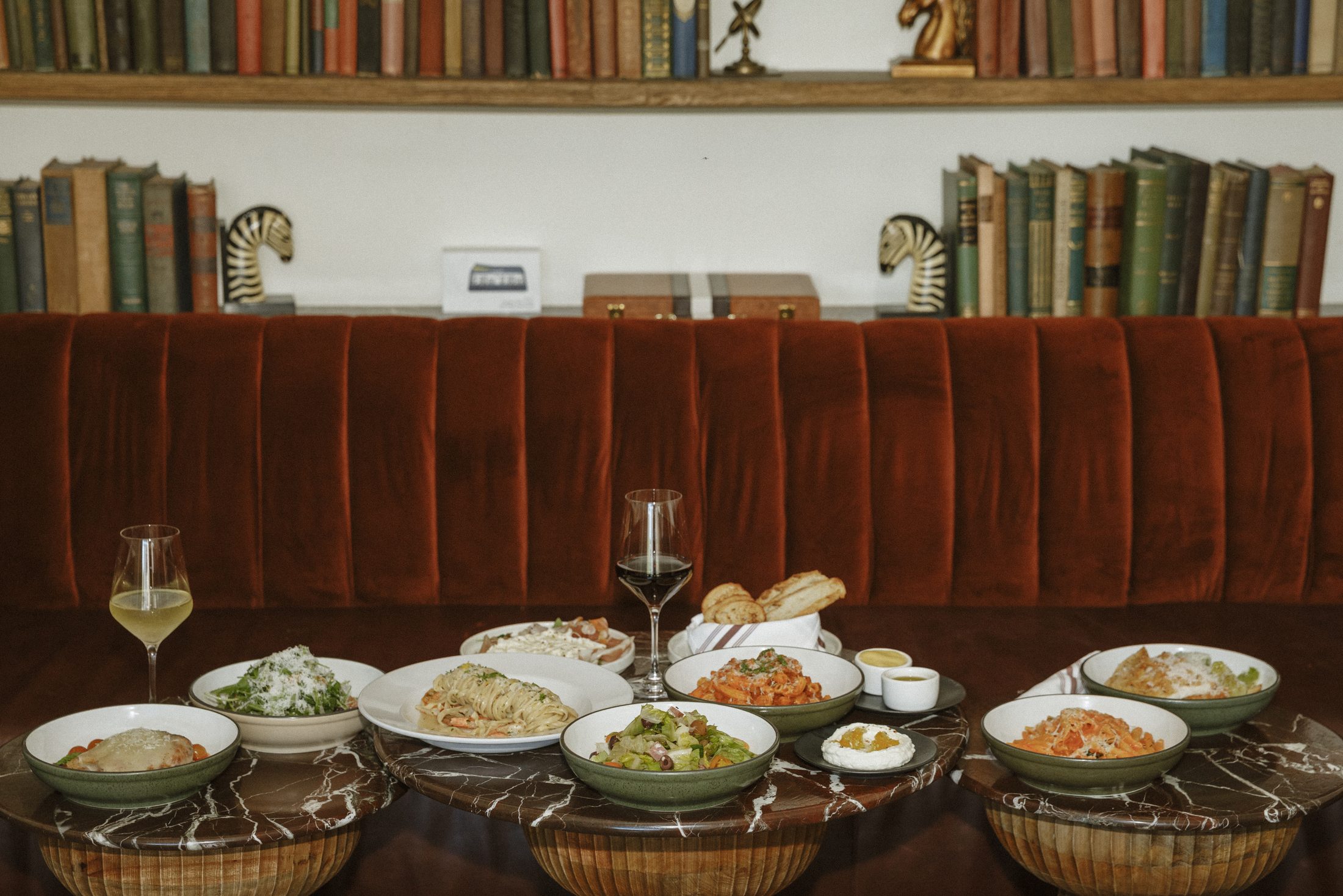 A candlelit table mid-meal